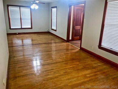 The large living area features original slim plank