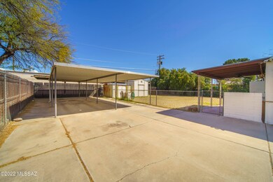 4 car carport and 2 storage sheds