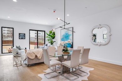Dining space with light wood finished floors, baseboards, and recessed lighting
