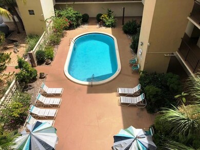 Front entrance to building.  Pool lounge & picnic