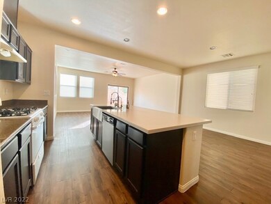 Dishwasher in island next to sink.  Dining area ac