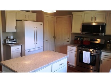 Kitchen with Island and Solid Stone Countertops