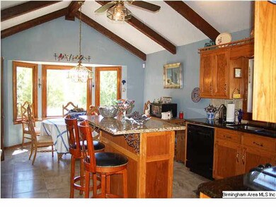 Beautiful vaulted kitchen has island w-eating bar 