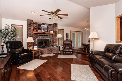 Spacious living area with vaulted ceilings and woo