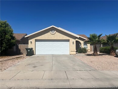 Ranch-style house featuring a garage