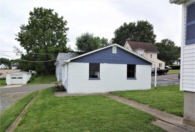 The 2 car garage is freshly painted and has a new roof