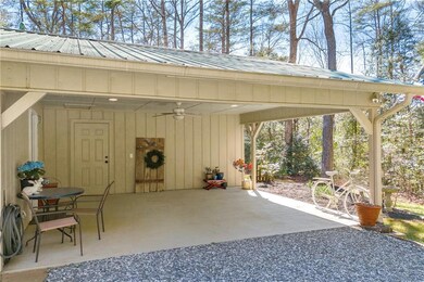 View of patio / terrace featuring a carport and ce