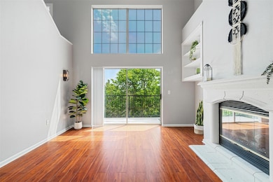 Unfurnished living room with wood finished floors