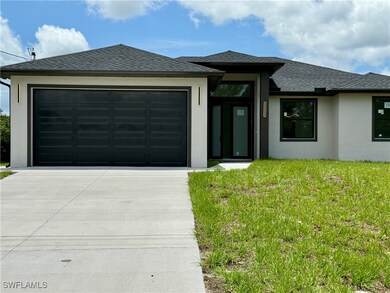 Prairie-style house featuring concrete driveway, s