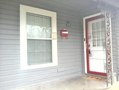 Covered front porch, and nice storm door.
