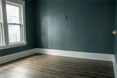 View of wood floored empty bedroom room
