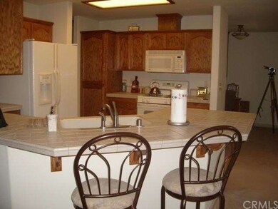 Tile counters and oak cabinets. 