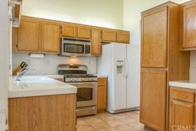 The kitchen is spacious, offering stainless steel 