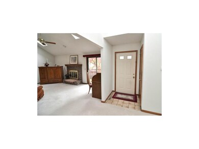 Welcoming entry with tile floor and coat closet