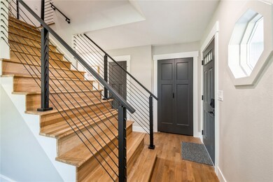 Real wood steps & custom railing. 2nd door is a po
