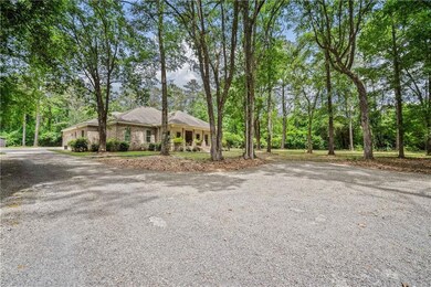 Ranch-style home with gravel driveway