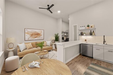 Kitchen with stainless steel dishwasher, a sink, 