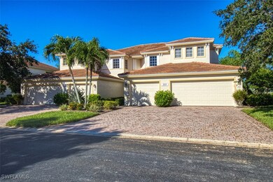 View of front of home with decorative driveway, a