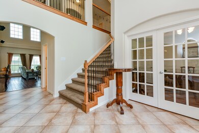 Study with French doors is to your right.