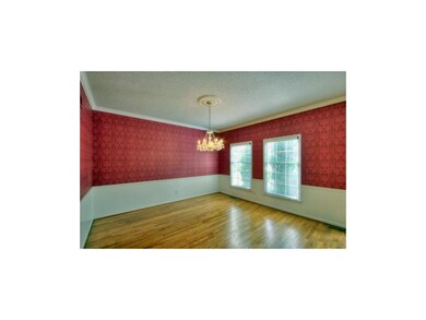 FORMAL DINING ROOM W/ CUSTOM LIGHT FIXTURE