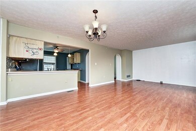 Looking towards kitchen, open and bright!