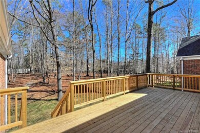 Enjoy dining on your new rear deck in natural surr