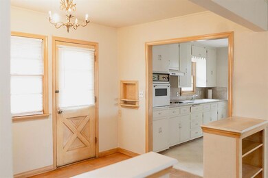 Kitchen featuring white appliances, under cabinet 