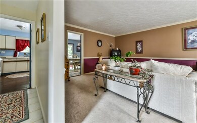 Ceramic flooring in entry and opens to living room