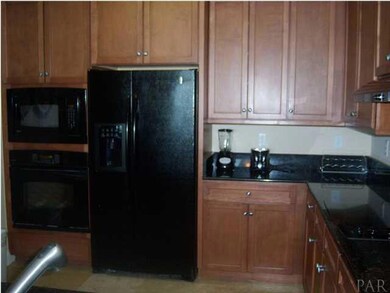 The breakfast bar features a granite countertop.