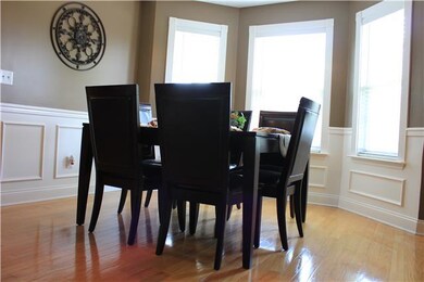 Beautiful dining area with picture framed trim and