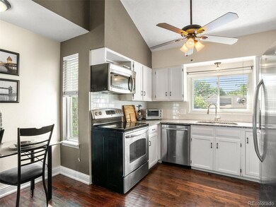 Kitchen has plenty of storage, granite counters, l