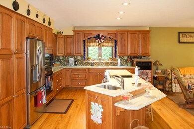 Updated kitchen with hickory cabinets and a center