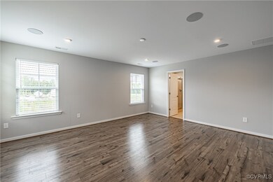 Empty room featuring dark hardwood / wood-style fl