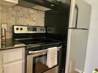 Kitchen featuring stainless steel range with elec