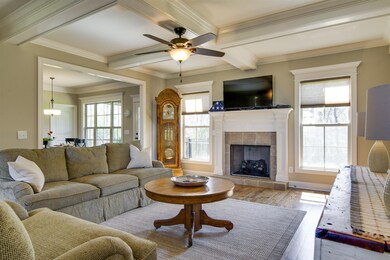 Coffered  ceilings fireplace, columns, custom shades throughout the home.