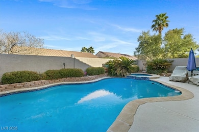 View of swimming pool with a fenced backyard, a pa