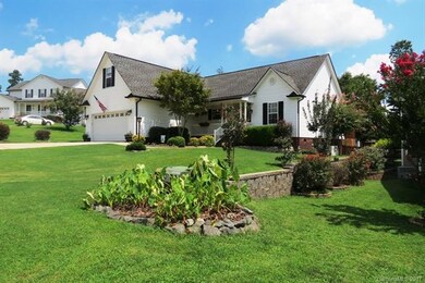 BEAUTIFUL LANDSCAPING ALL THE WAY AROUND THIS HOME