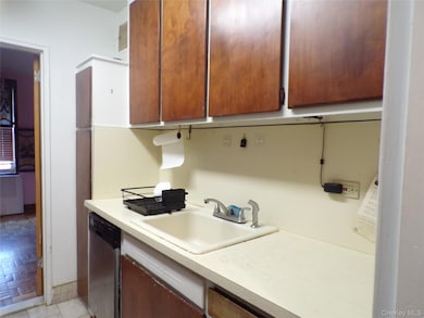 Kitchen with light countertops and dishwasher