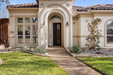 Doorway to property featuring a lawn