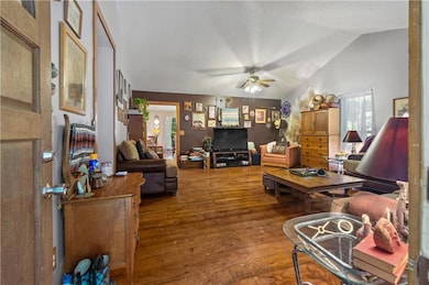 Vaulted ceilings and wide-plank heart pine floors in your spacious living area.