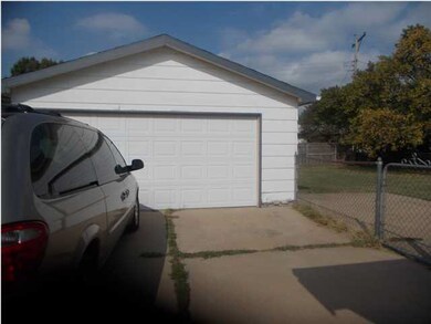 Oversized detached garage.