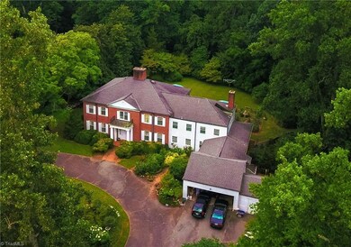 Front aerial view of house and grounds