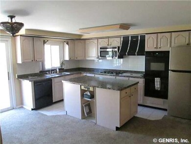 Kitchen. New stainless refrigerator, granite look 
