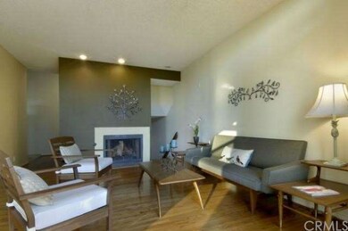 Living room boast fireplace with ceramic hearth