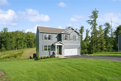 View of front of home featuring a garage and a fro