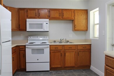 Large kitchen with new appliances. Lots of cabinet