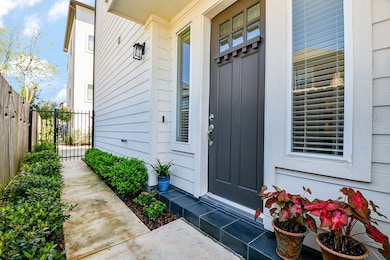 Gated entry and private front walkway leading to y