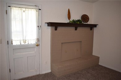 Another view of the fireplace and back door