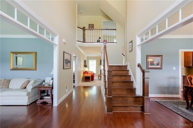 The 2-story Foyer invites you in to an immaculate house with a dual staircase