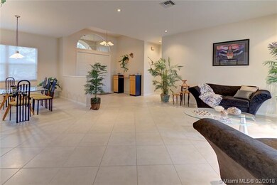 ARCH SUNBURST ENTRY WITH HIGH VOLUME CEILINGS.